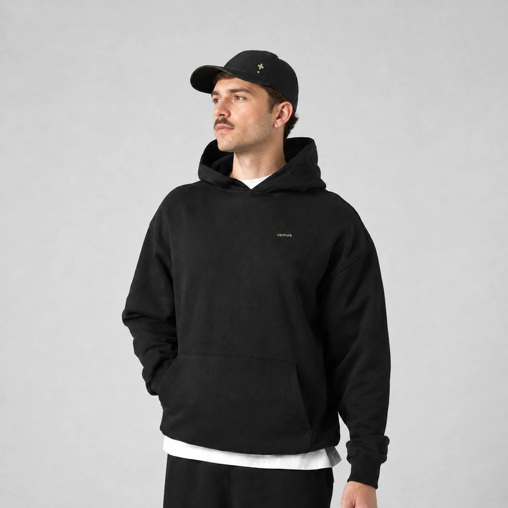 Vanture Beginning Hoodie in black worn by male model, front view
