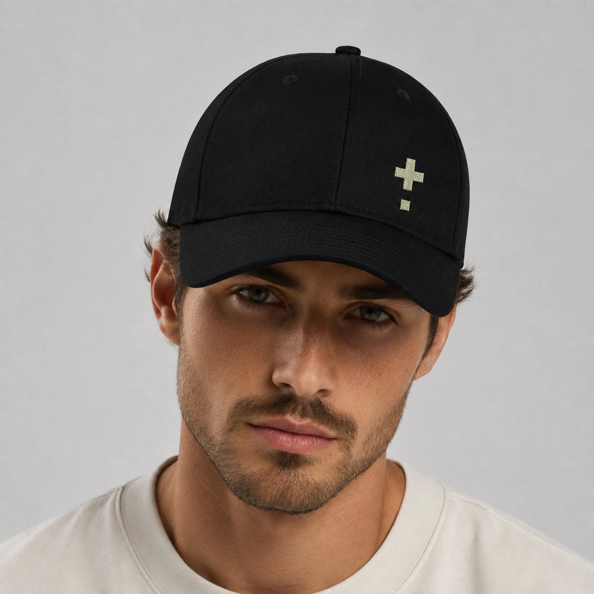 Black Vanture Icon Cap worn from the front showing the embroidered icon