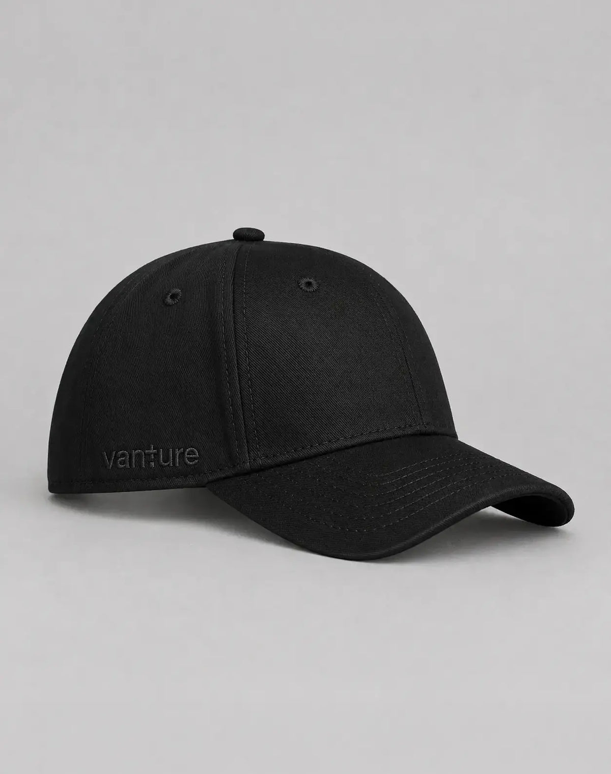 Side view of the black Vanture Icon Cap showing tonal Vanture embroidery