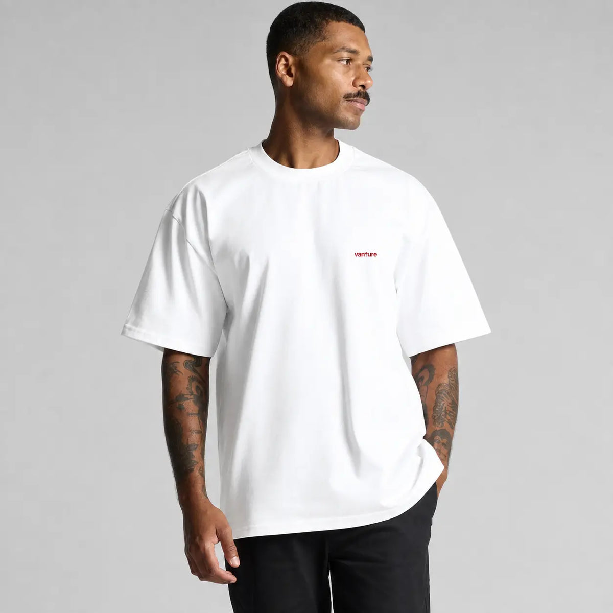 Front view of the white Vanture T1 Era Tee showing the small Vanture chest print
