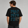 Rear view of the black Vanture T2 Era Tee showing the 1967–1979 back artwork