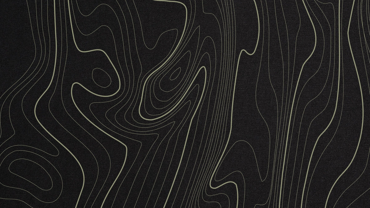 Black Vanture graphic with sand green topographic contour lines