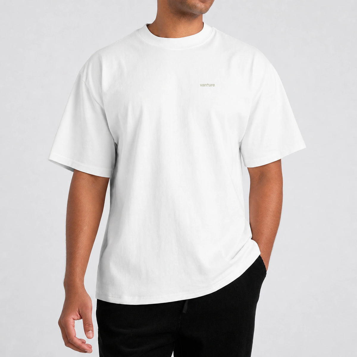 Model wearing the Vanture Your Journey T-shirt with small chest logo