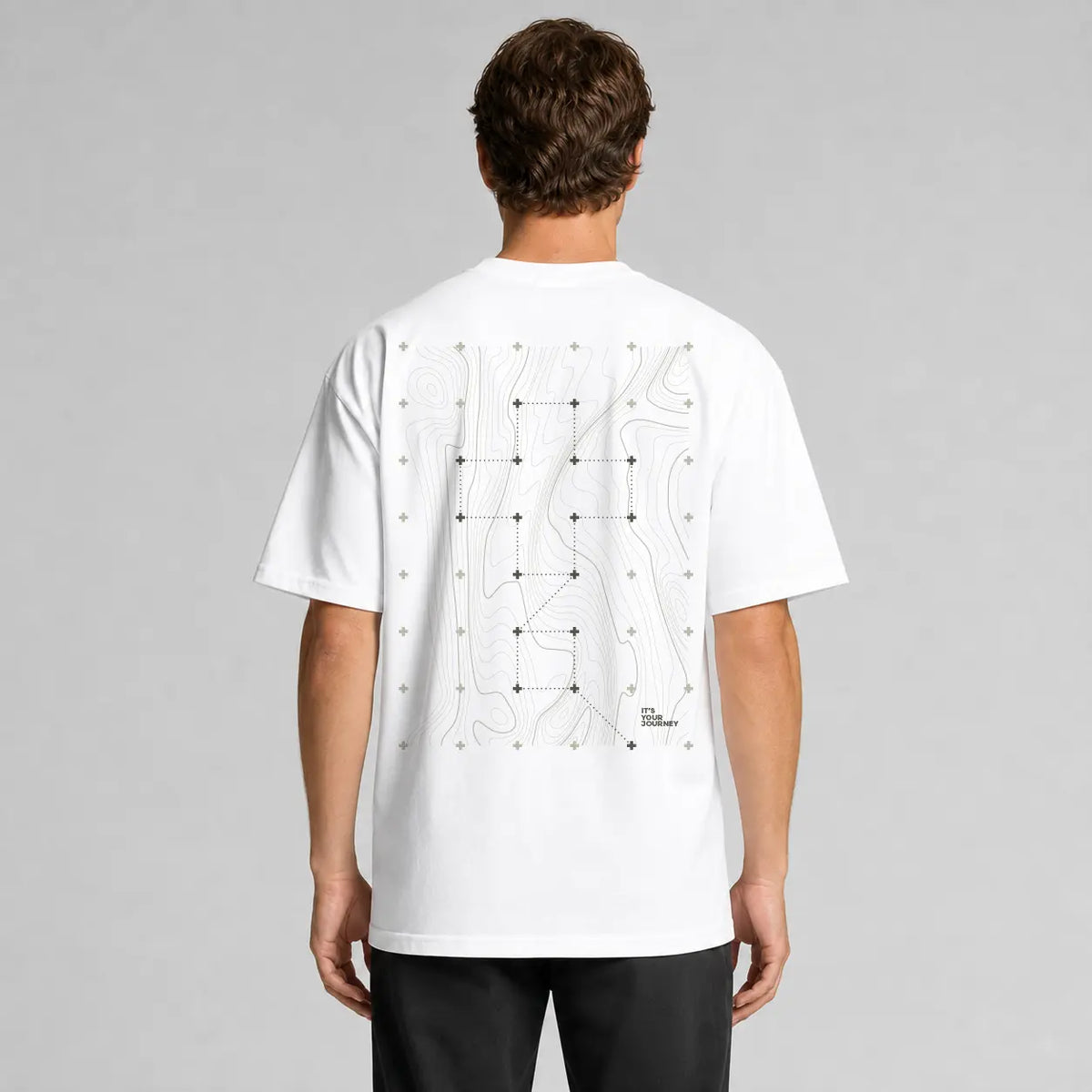 Rear view of the white Vanture Your Journey Tee showing the topographic back artwork